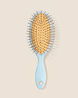 REN Summer Mini detangling hair brush in blue