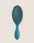 REN. Ultimate detangling brush in Turquoise