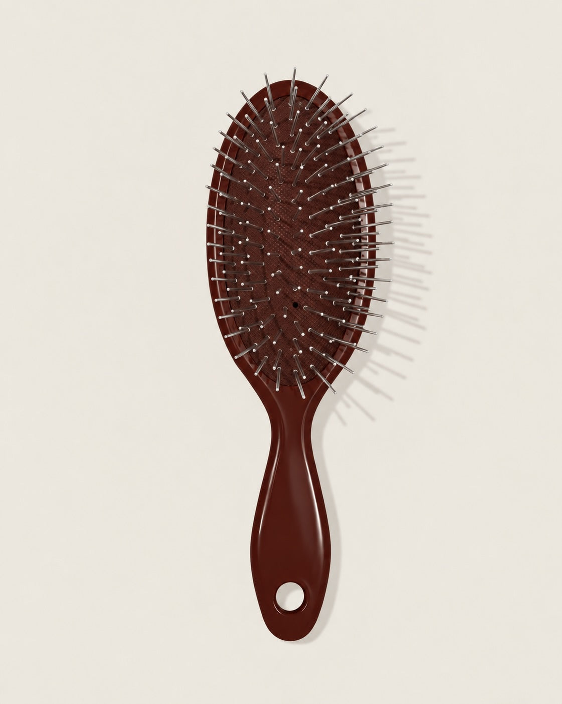 The Mini Ren - Bordeaux - A dark reddish-brown hairbrush with silver metal bristles.