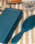 REN. Ultimate detangling brush in Turquoise, Limited Edition