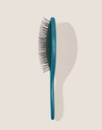 REN. Ultimate detangling brush in Turquoise